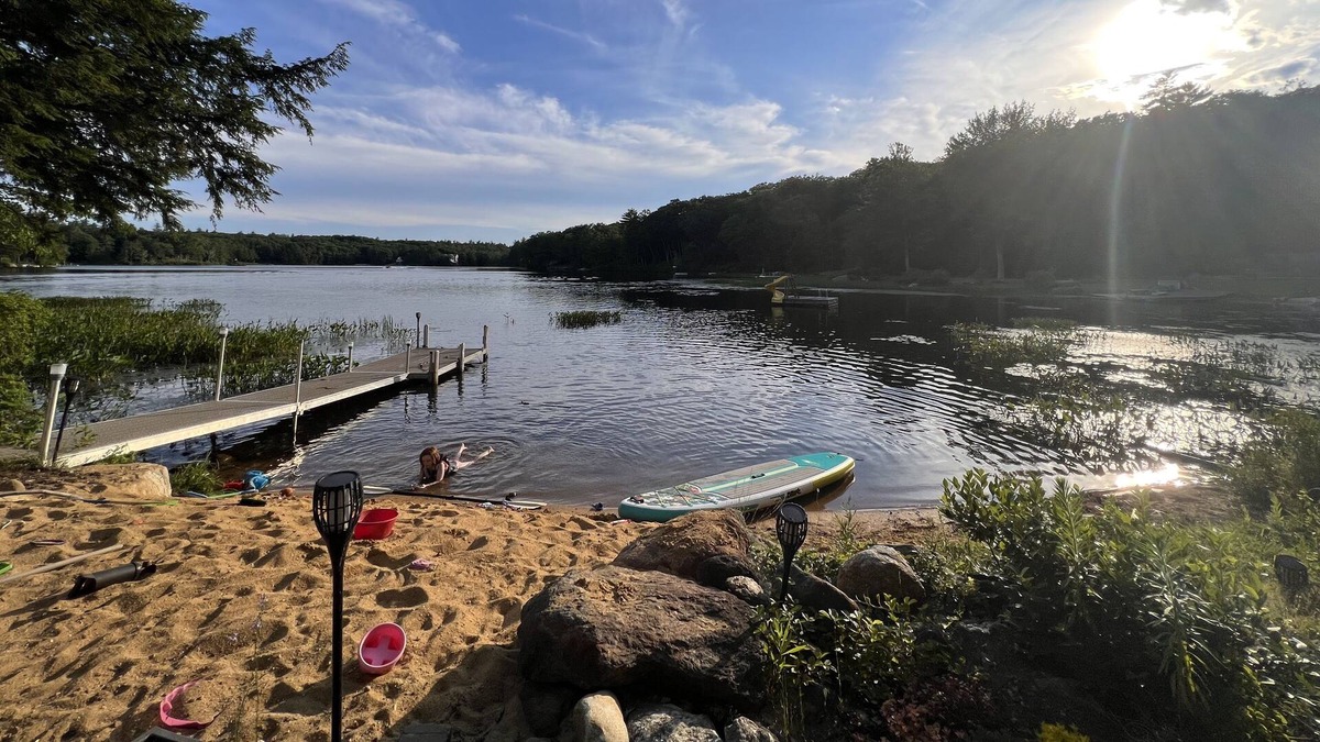 Barnstead House | Cozy home with private beach on Huntress Pond and short drive to skiing!