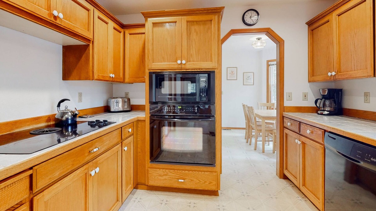 Zigzag House | Cozy home with river access, private hot tub, wood stove, fireplace, & W/D