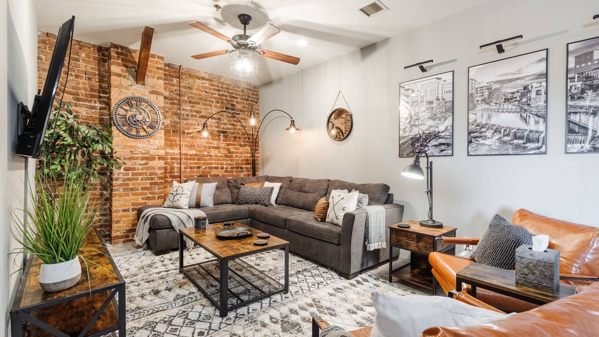 Greenville Downtown Apartment | Cozy Industrial 2-KING Bdrm S. Main Street Downtown Condo w/Foosball Table