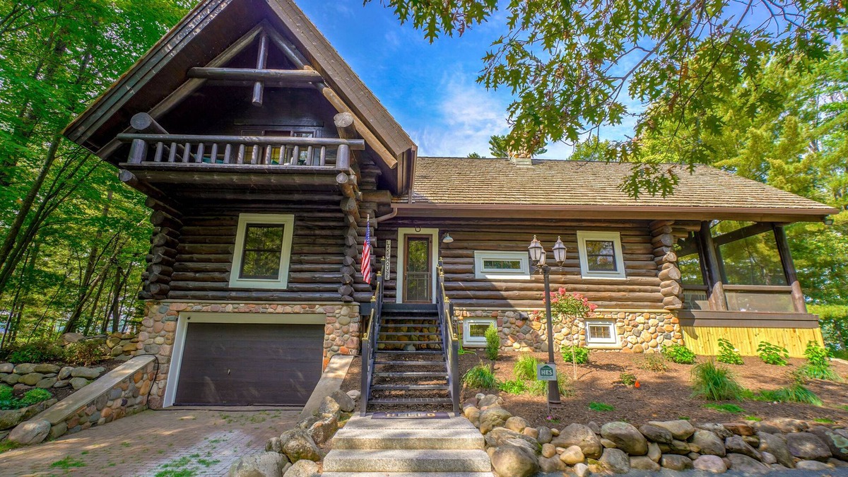 Spooner Cabin | Cozy Lake front luxury, hot tub, ice fish, snowmobile, fireplace, screened porch