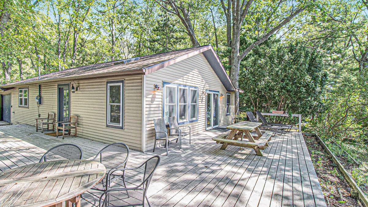 Allegan Cottage | Cozy, lakefront cabin with gas grill and wrap-around deck.