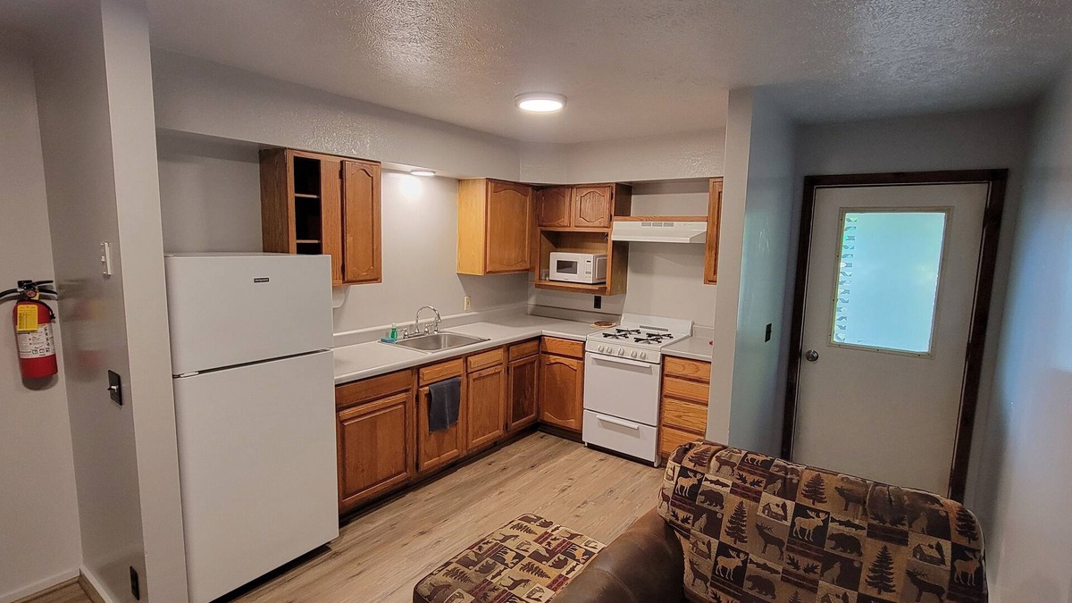 Bellaire RV Rental | Cozy little cabin in a campground backed up to the peaceful woods.