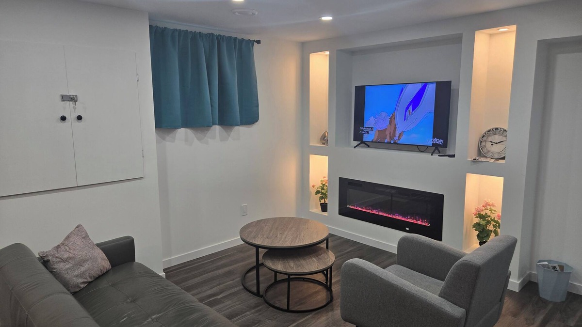 Winnipeg House | Cozy private bsmt suite |Bonavista |Fireplace, workspace & nature-inspired decor