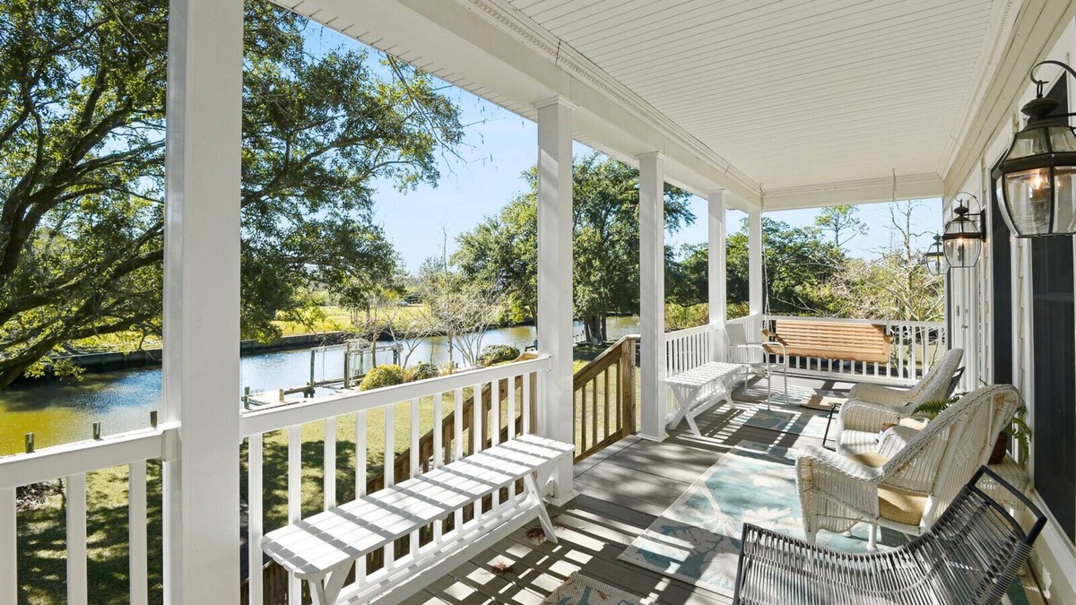 Henderson Point House | Cozy Raised Cottage Overlooking Beautiful Bayou Mallini