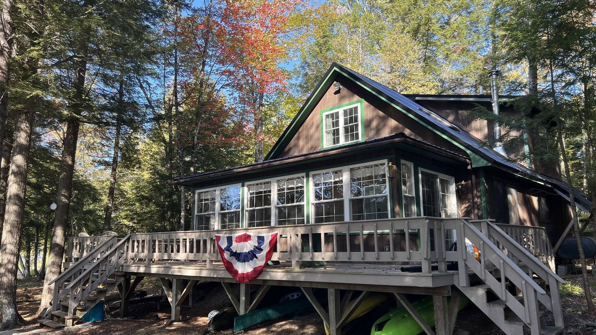 Bowerbank Cottage | Cozy Sebec Lake front cabin with dock and fire pit