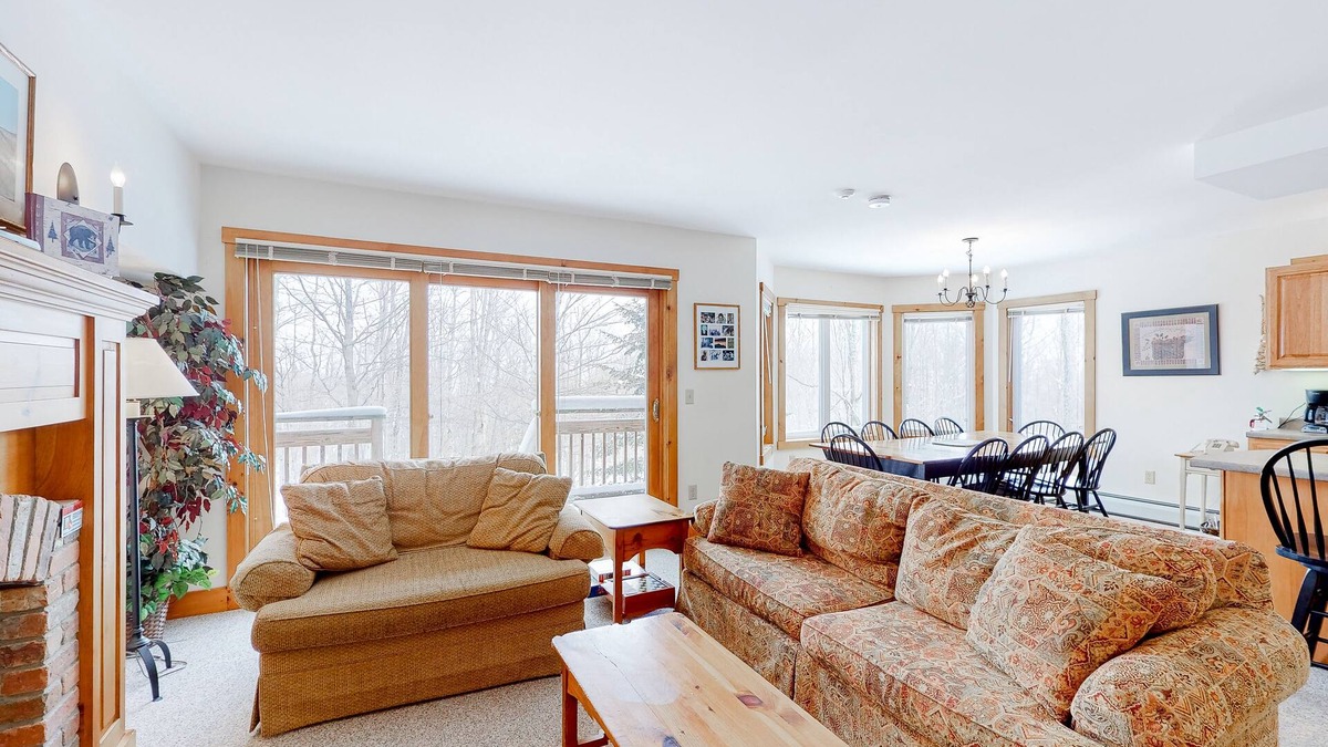 North Troy Condo | Cozy ski-in/ski-out home next to Grammy Jay trail with fireplace, mountain views