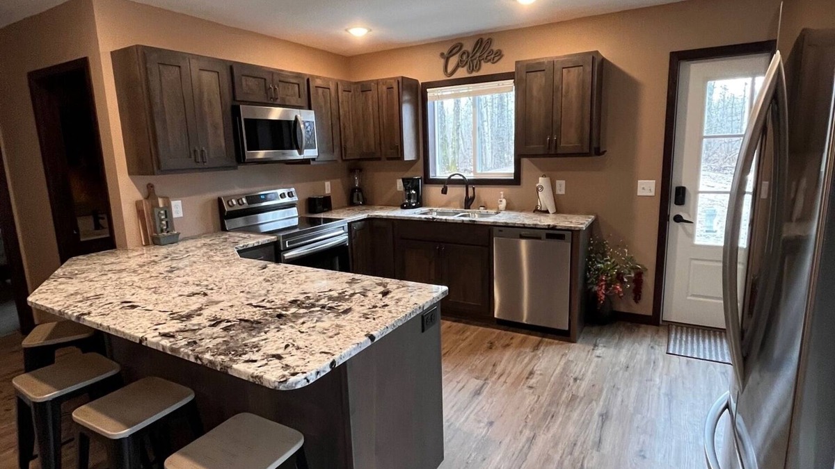 Bemidji House | Cozy two level home - 2 minutes from beach on private wooded lot.