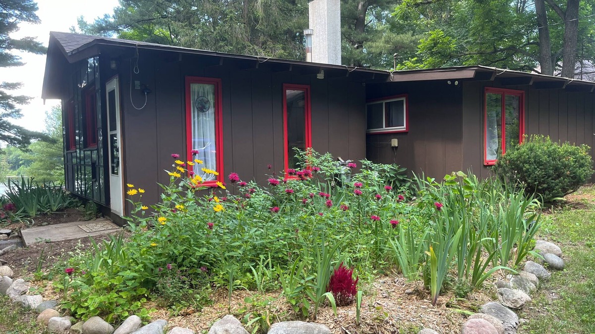 Lake Ann House | Cozy waterfront sunset cottage on Herendeene Lake in Lake Ann, Dock, Dog ok