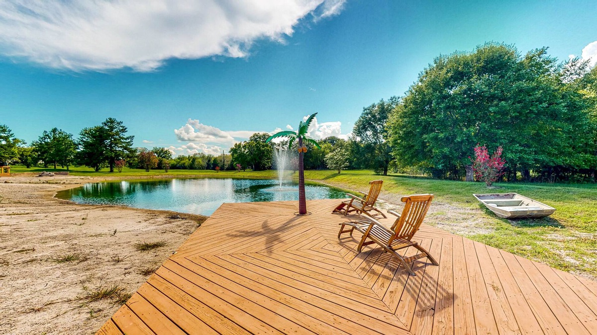 Waller House | Custom Home with Guesthouse, Pond, Swimming Deck, Beach & Tropical Bar
