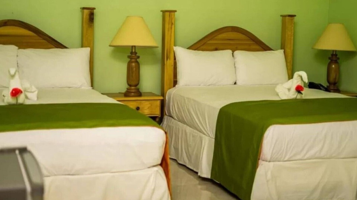 Runaway Bay Resort | Deluxe Quadruple Room, 2 Queen Beds, Garden View