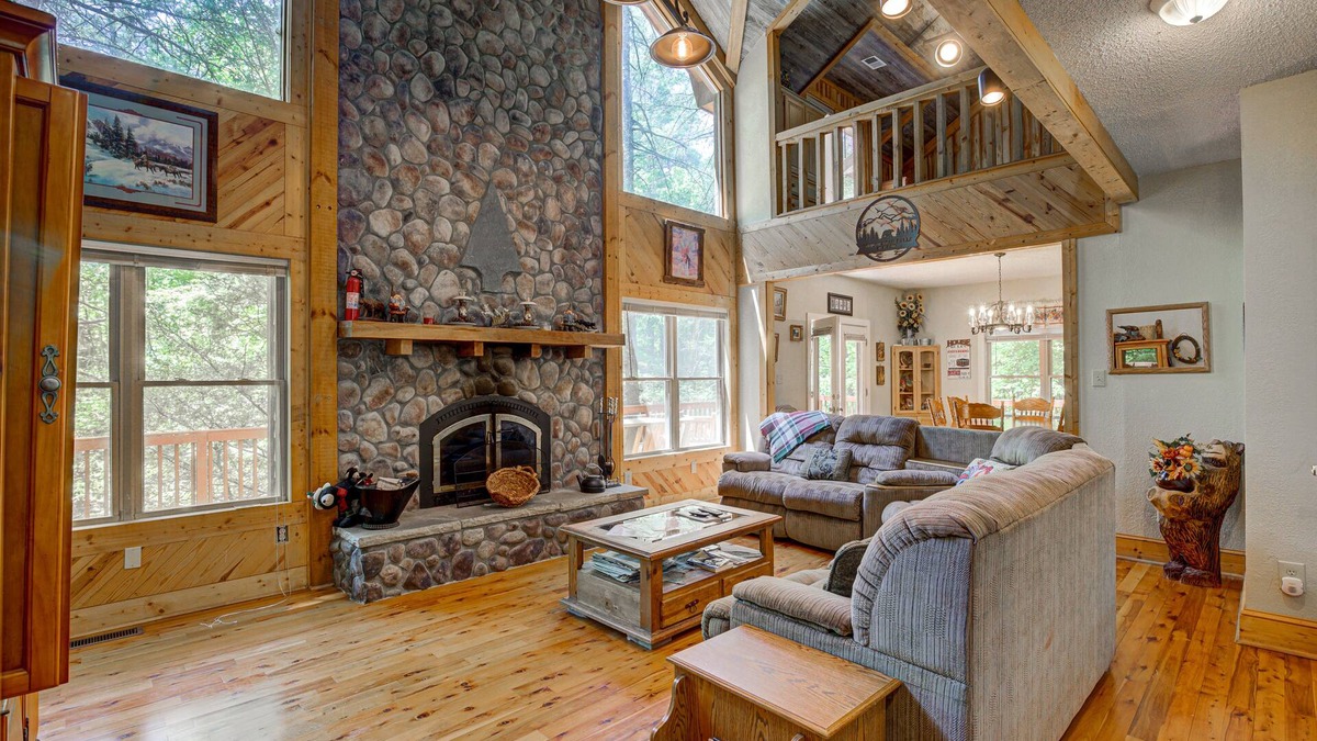 Wiley Cabin | Dog-friendly riverfront cabin with waterfall view, large decks, firepit, Ping-Pong