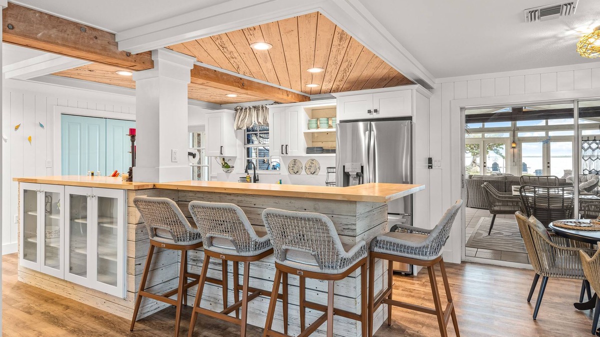 Bay Point House | Dog-friendly waterfront home with outdoor kitchen, bar, firepit, & kayak launch