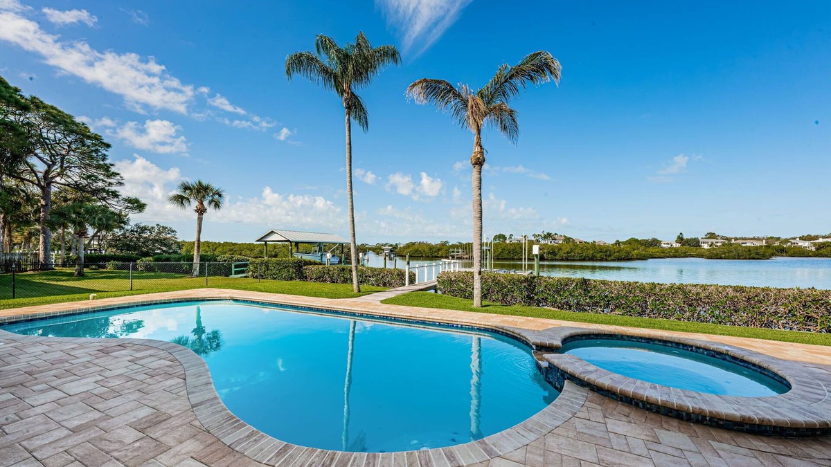 Palm Harbor House | Dolphins in your backyard! Peaceful waterfront oasis w/sparkling pool & hottub.