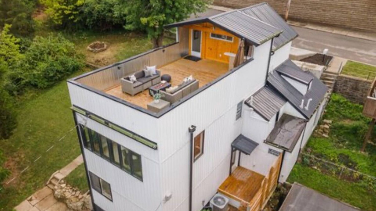 Covington House | Downtown skyline vista featuring giant rooftop deck & wet bar with a city view