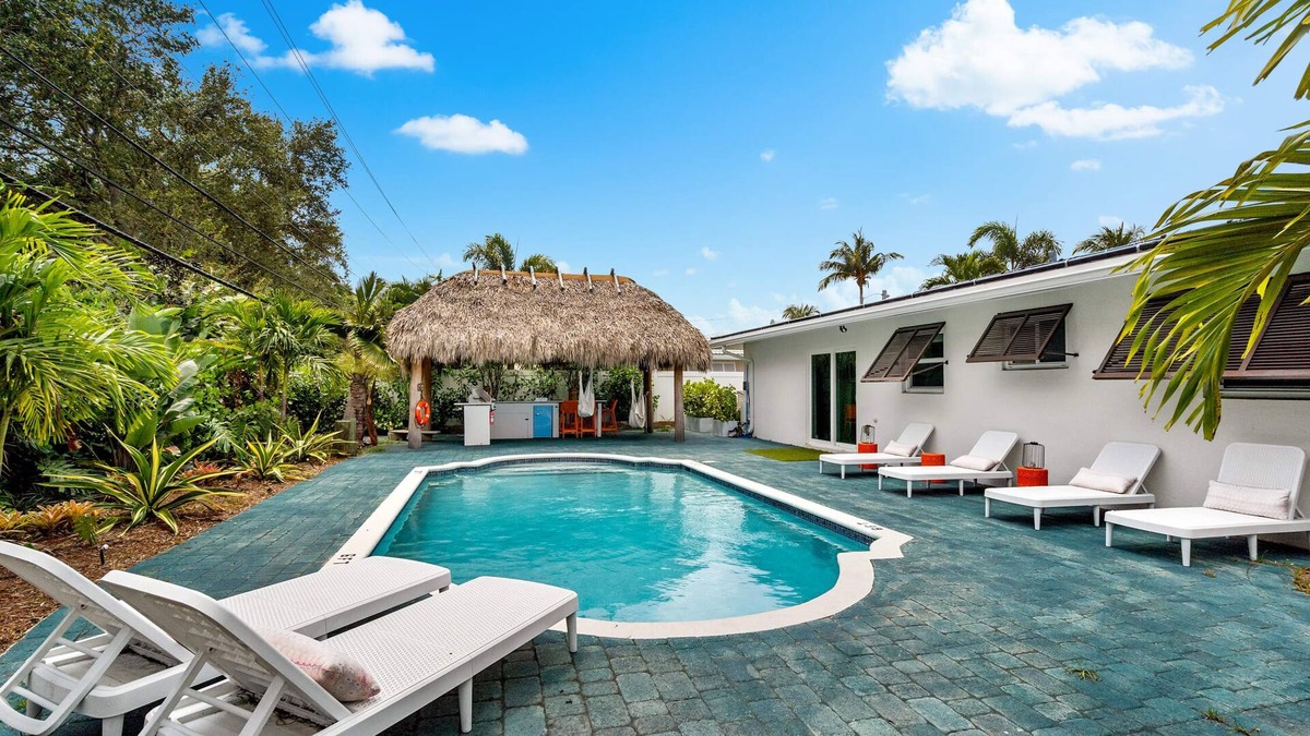 Garden Isles House | Eccentric home with pool, tiki hut & outdoor kitchen
