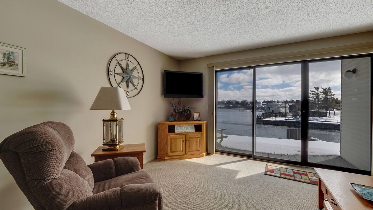 Charlevoix Condo | Edgewater Inn 115 | Sunrise Over Lake Charlevoix | Pool, Hot Tub, Sauna