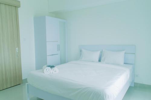 Pondok Aren Apartment | Elegant 1BR without Living Room at Bintaro Embarcadero Suites Apartment By Travelio