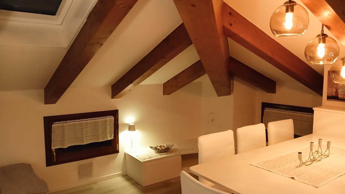 Levico Terme Apartment | Elegant attic with Dolomites view, relaxation and nature in Levico Terme.
