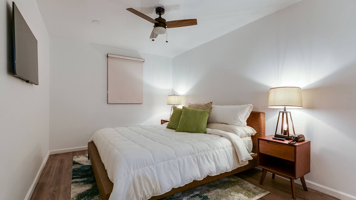 San Angelo Hotel | Elegant Suite with Separate Living Room & Mini Fridge – Ideal for Relaxation and