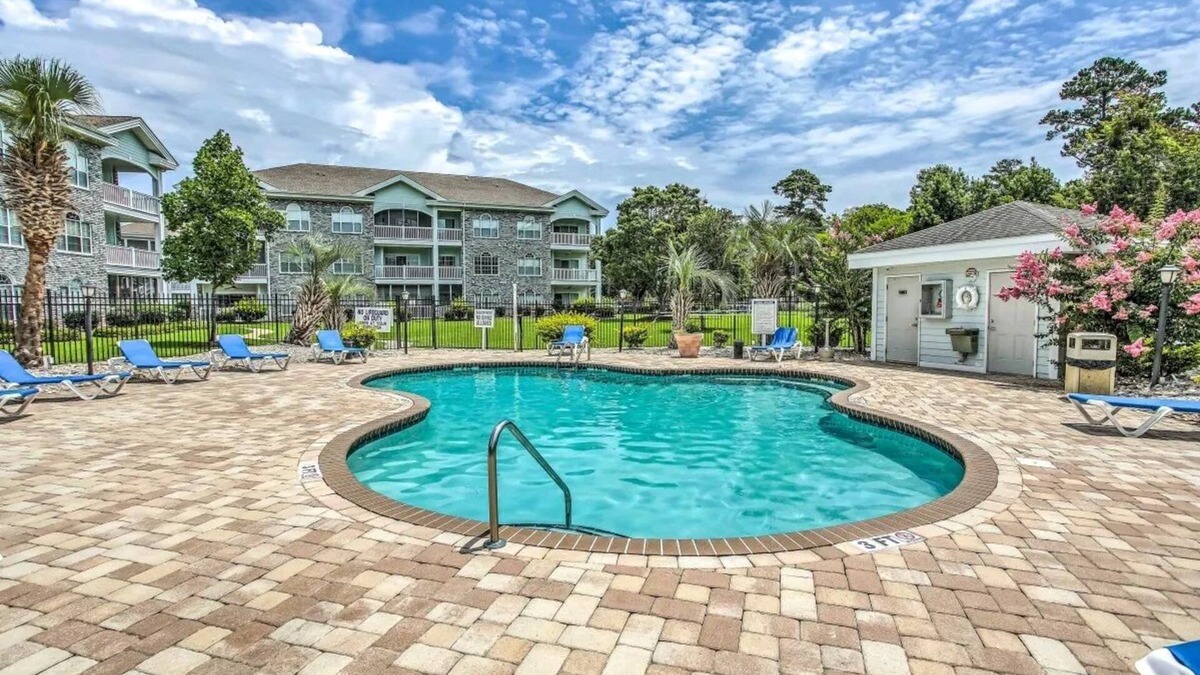 Central Myrtle Beach Condo | Endless Summer Coastal Condo at Magnolia Place - Pool & Golf Course Views!