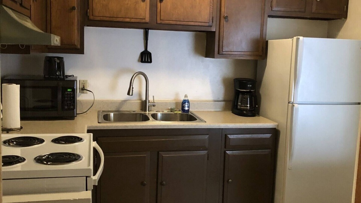 Maple Heights Apartment | English Tudor Apartment with Assigned Covered Parking