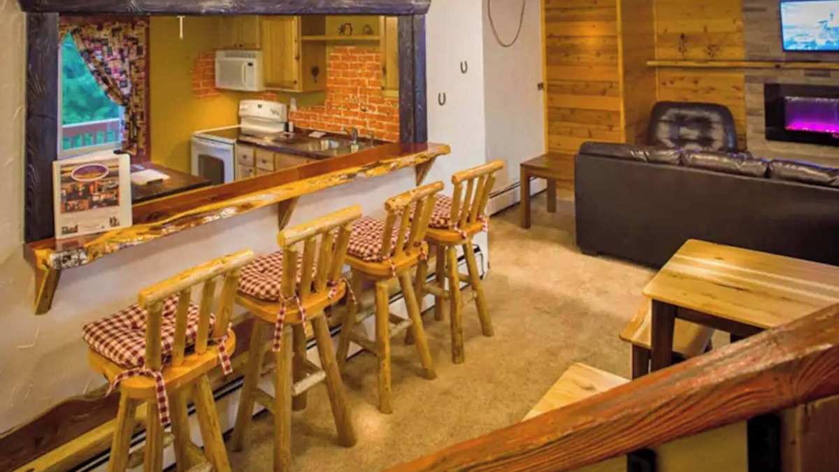 Rice Lake Ski Chalet | Enjoy a quiet stay on your own private deck by the lake in Room 21: Ponderosa-a Western Themed Chalet