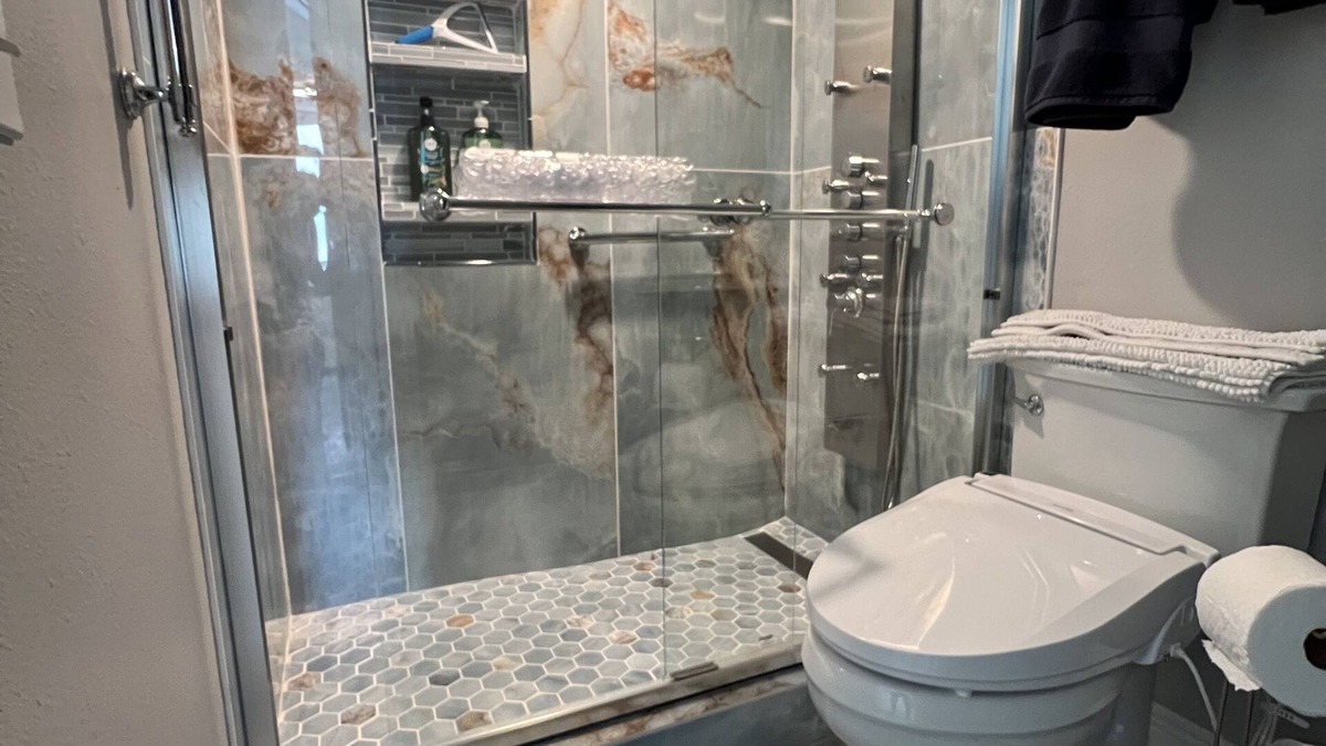 Sunnyside House | Enjoy inside and out! One step to sand and back to a shower tower or a Jacuzzi