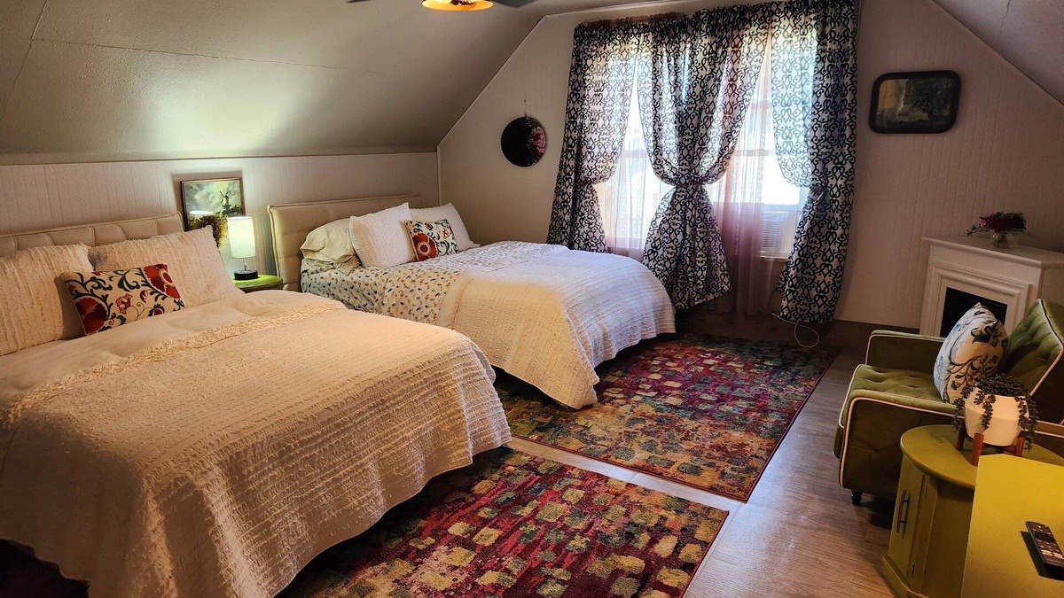 Lansing House | Enjoy the top floor of this victorian house nWith two suites & a bonus bedroom