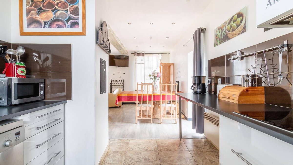 Ferriere-la-Petite House | Enjoy this cozy and pretty vacation home by a stream in green surroundings.