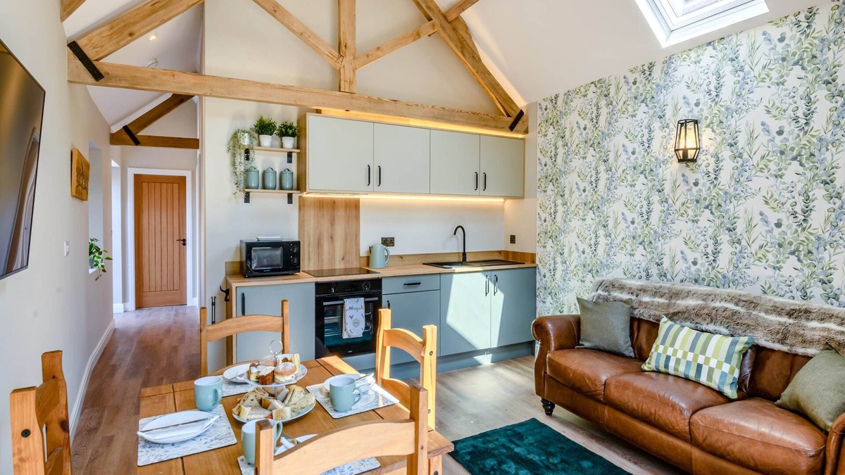 Arnold Cottage | Exposed beams and calming green colours for this holiday home.