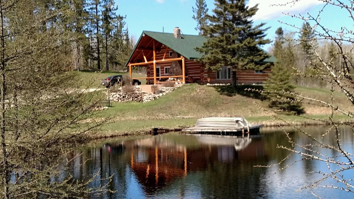 Perronville Cabin | Family friendly comfy log lodge and pond.