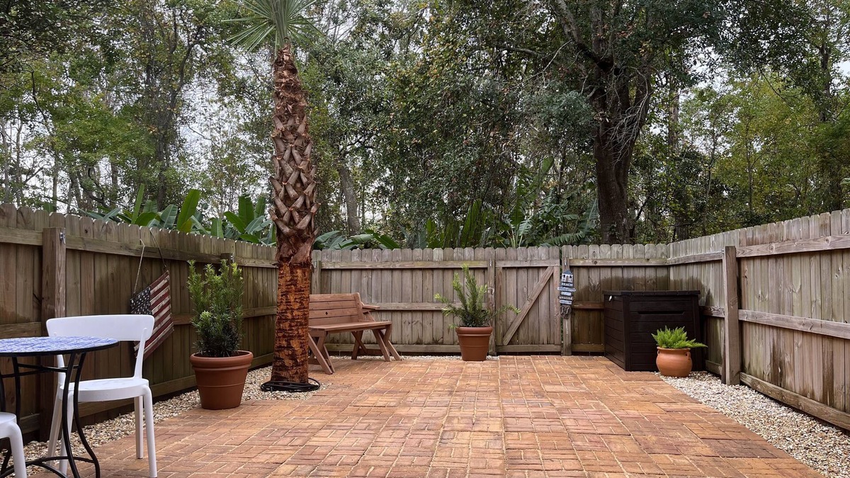 Pensacola Condo | Family Friendly Condo minutes to beach w/large pool and private outdoor space.