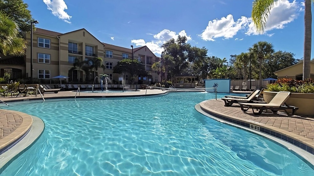 Florida Central Atlantic Coast Hotel | Family Group Getaway NEAR DISNEY! Three Comfy Suites, 4 Pools, Shuttle to Parks