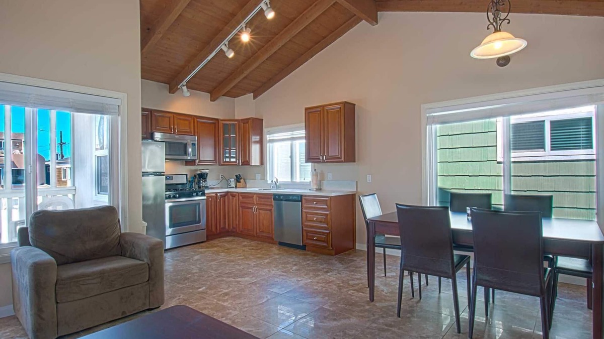West Newport Condo | Fantastic and newly-remodeled upper unit just one house from the warm sand