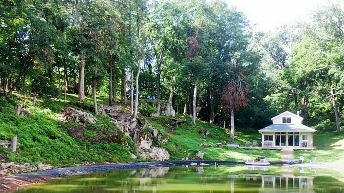 Front Royal Cabin | Fantasy Getaway Cottage on Private Pond with Waterfall, Rock Pool and Hot Tub