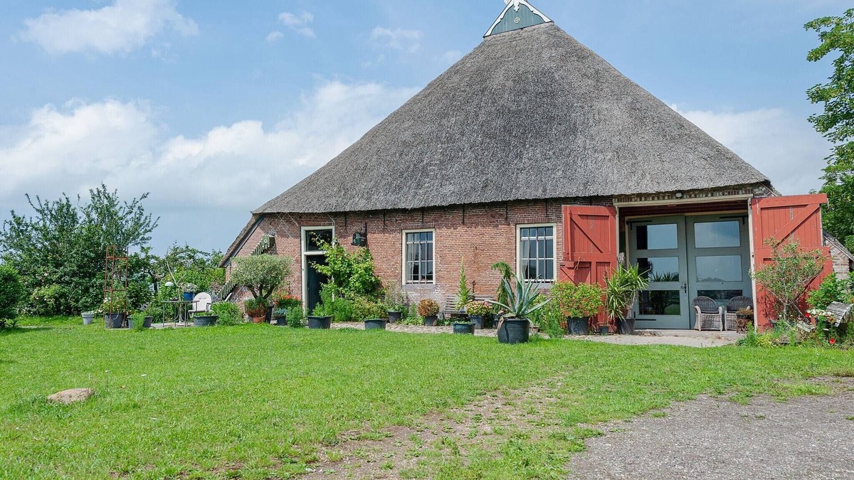 Burum Apartment | Farmhouse by Lauwers River with Rowing Boat