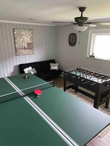 Johnson City House | Farmhouse with game room, fire pit and creek