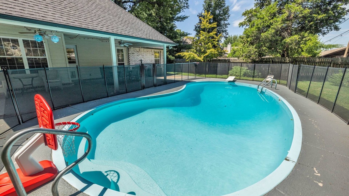Tulsa House | Fenced in Pool-Jacuzzi Tub-Walk to Dining & Shopping-Garage Parking-Gym
