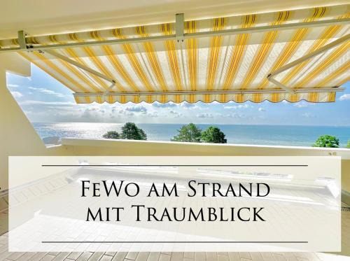 Sierksdorf Apartment | FeWo Traumblick - Himmel & Meer mit TRAUM Meerblick am Strand mit großem Balkon - WLAN, Streaming, 2024 modernisiert