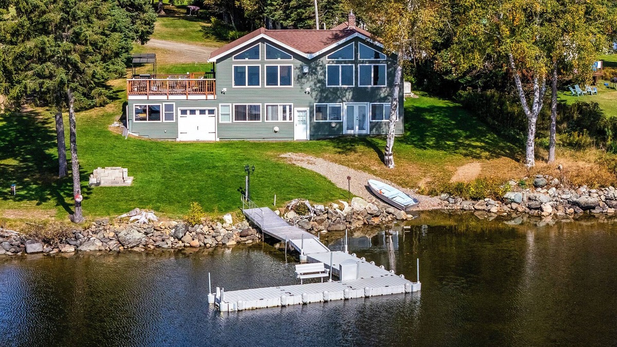 Rangeley House | Fielding Lakehouse - Spacious home with nice grass area leading to Rangeley Lake