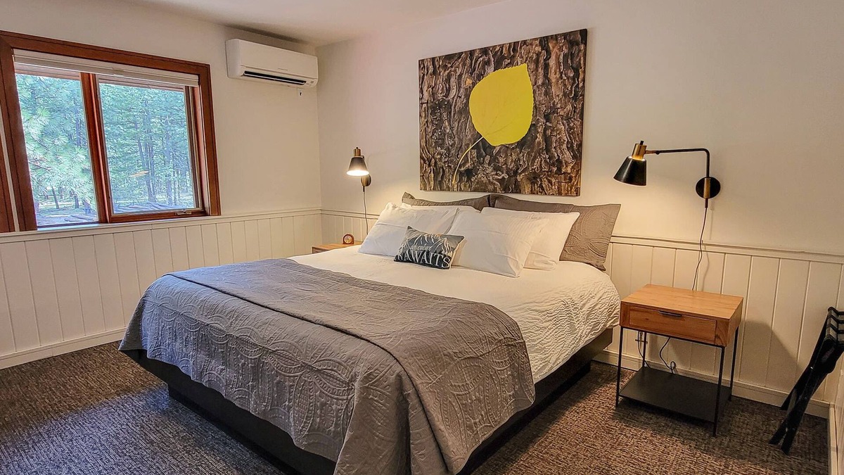 Mazama House | Fir - king bedroom with couch at The Inn At Mazama