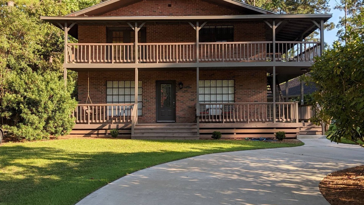 Brookeland House | Fishers Foxhole - two story home with wrap around deck and lake access.