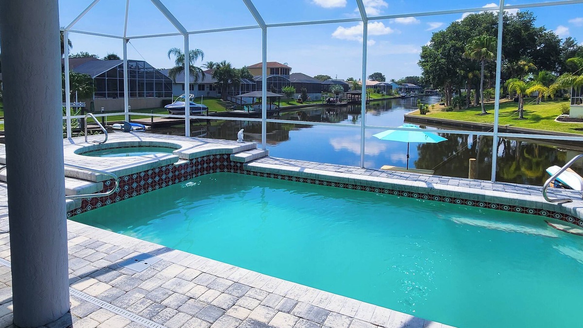 Palm Harbor House | Five Star 3bd Waterfront Canal Home w/Private Pool/Spa & Boat Dock.