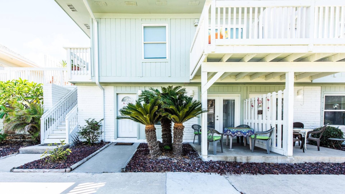 Port Aransas Villa | Flamingo House - First Floor Unit that’s a 5-7 minute walk to the beach.