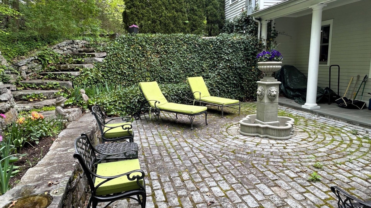 New Canaan House | Fountain Courtyard and Fireplace Kitchen