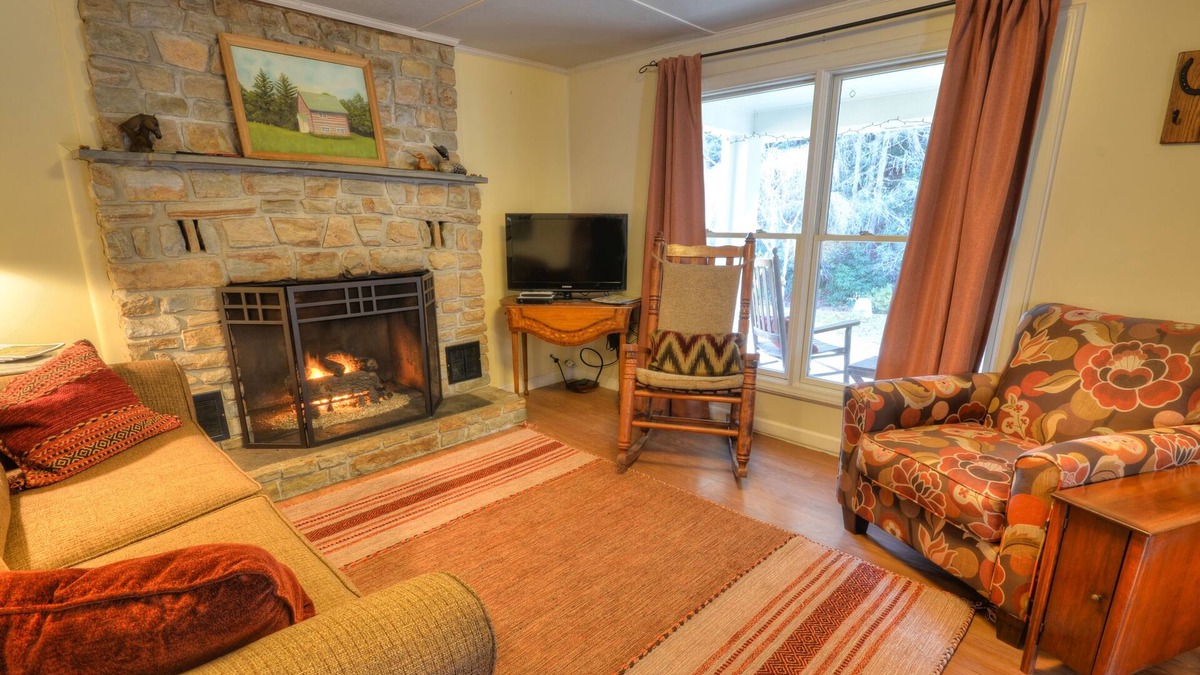 Almond Cabin | Front porch with bed swing, Pets Welcome, Hot Tub, Fireplace, Creek, Firepit.