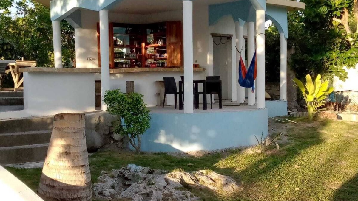 Little Bay Cottage | Fruit Tree Beach Cottage, Bar and Grill with private beach and beautiful sunsets
