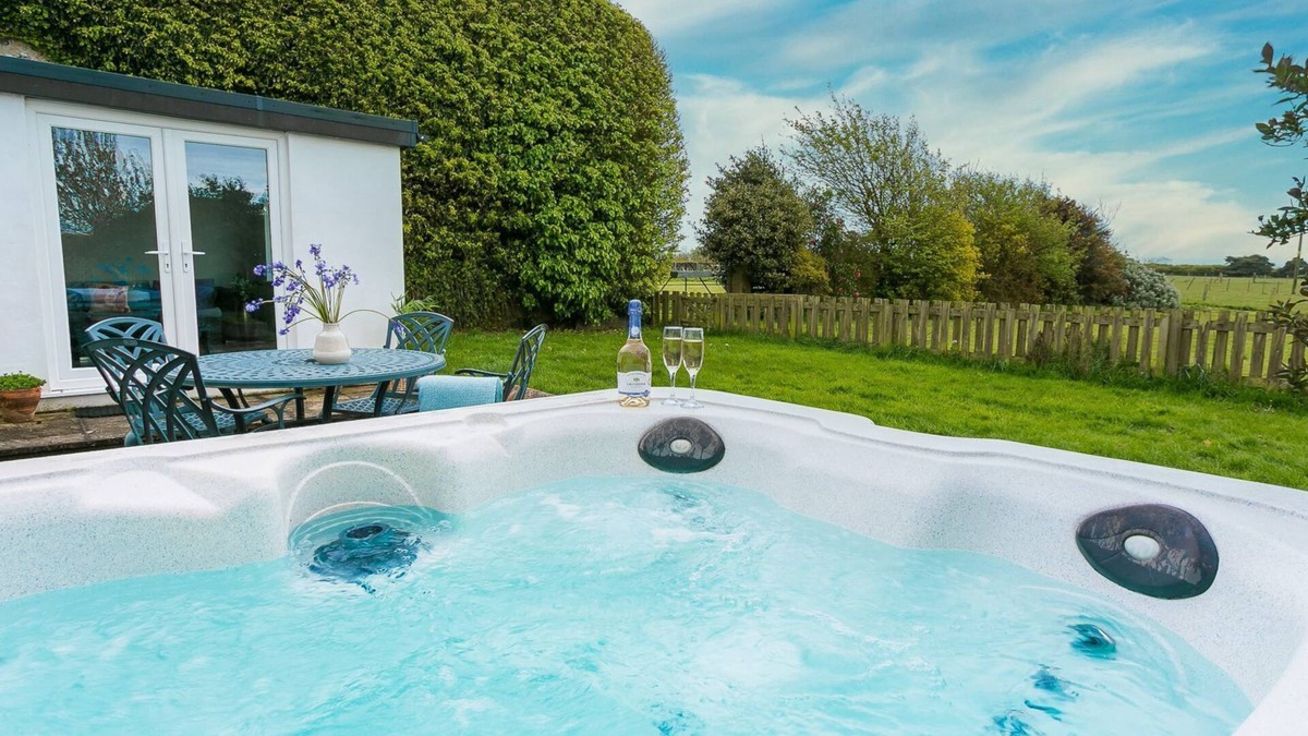 Bryngwran Cottage | Gamekeeper's - a hot tub that sleeps 4 guests in 2 bedrooms
