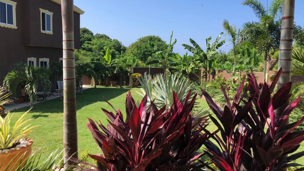 Runaway Bay Apartment | Garden View Two Bedroom Apartment with En-Suite, Open Kitchen and Living Room