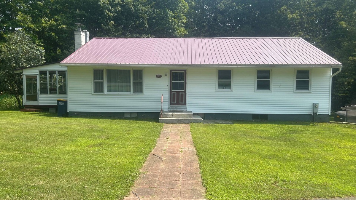 Taberg House | Glenmore Creek, ranch style home located on 10, mostly wooded, private acres.